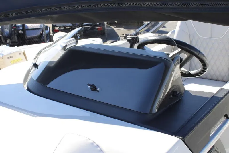 Slide: The Image of 2026 Avalon CATALINA 23 boat dashboard with steering wheel and protective windshield. - 21