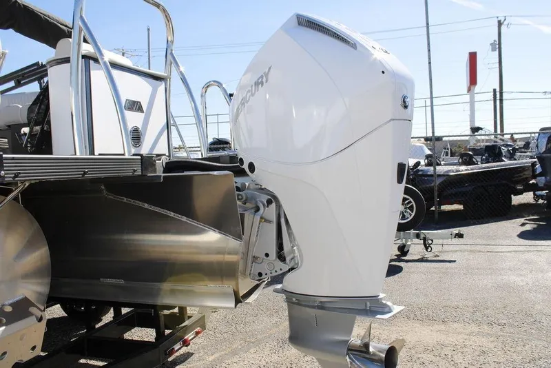 Slide: The Image of 2026 Avalon CATALINA 23 boat with Mercury outboard motor, displayed outdoors. - 24