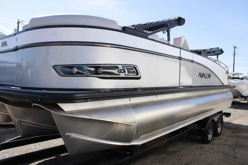 Slide: The Image of 2026 Avalon CATALINA 23 pontoon boat on trailer, sleek design, silver and white finish. - 25