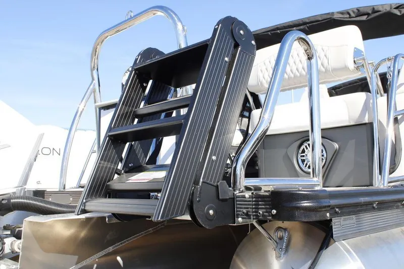 Slide: The Image of 2026 Avalon CATALINA 23 boat ladder and seating, featuring sleek chrome and black design. - 30