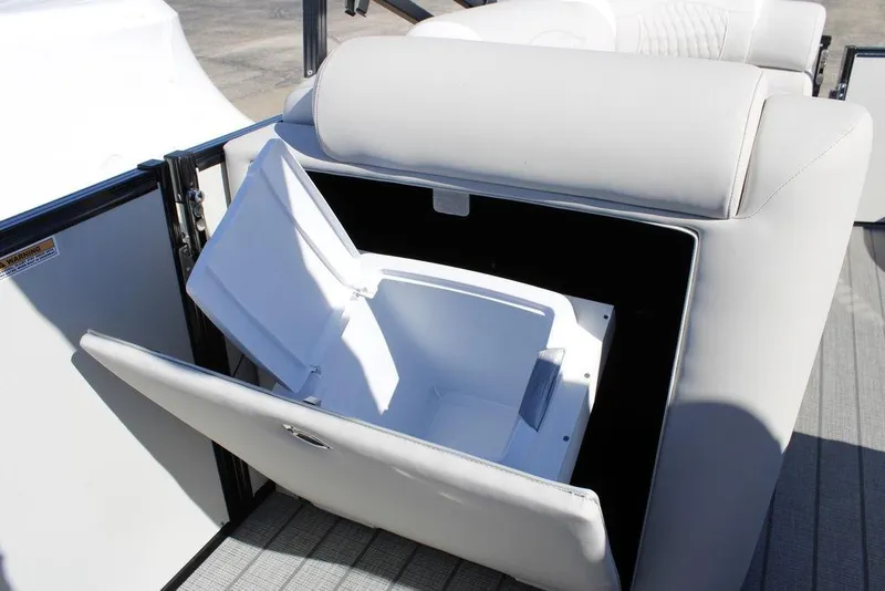 Slide: The Image of 2026 Avalon CATALINA 23 boat seat with built-in storage compartment open. - 8