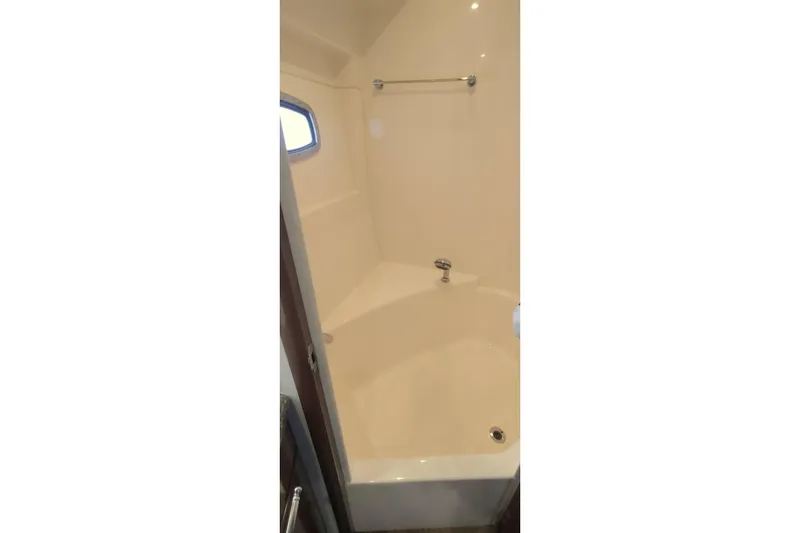 Slide: The Image of Shower area in 2007 Carver 52 Voyager yacht, featuring a sleek, compact design. - 11