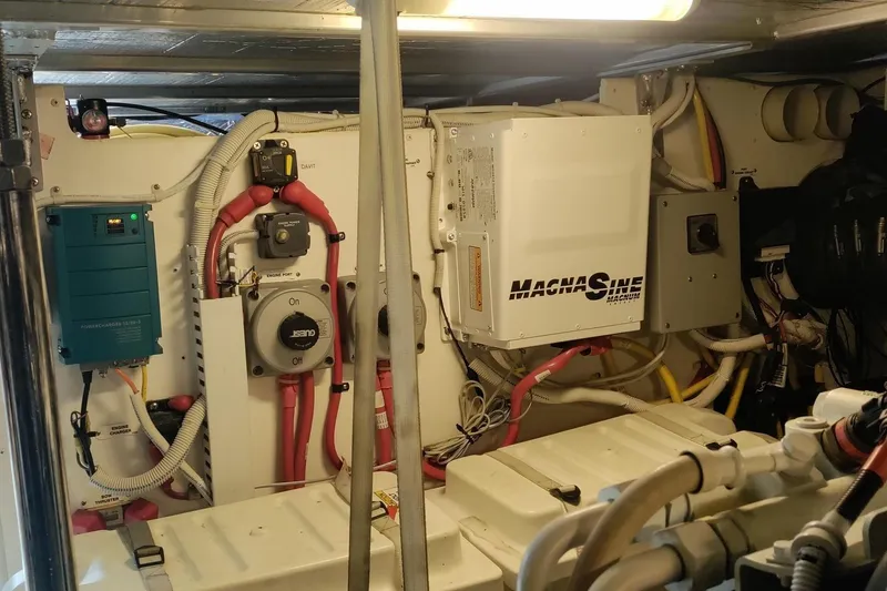 Slide: The Image of Engine room of a 2007 Carver 52 Voyager with electrical components and wiring. - 14