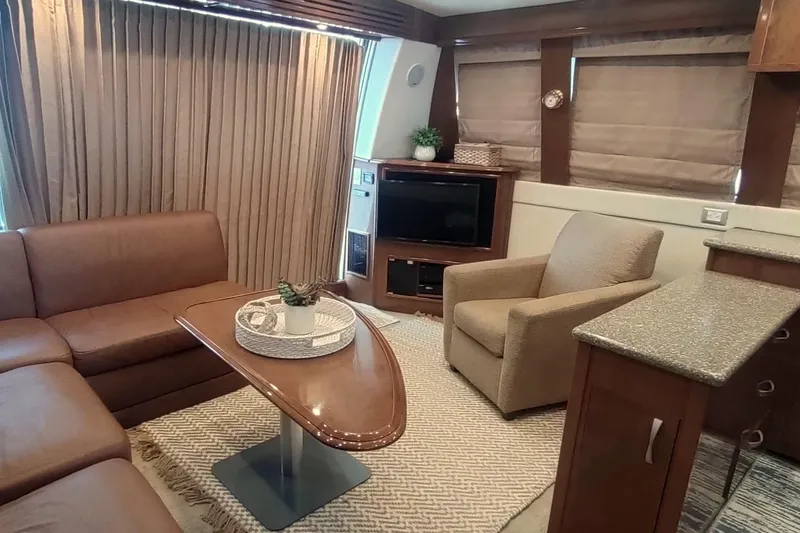 Slide: The Image of Luxurious interior of 2007 Carver 52 Voyager yacht with elegant seating and modern decor. - 3