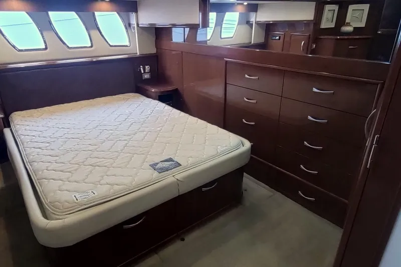 Slide: The Image of Luxurious bedroom interior of 2007 Carver 52 Voyager yacht with elegant wood finish. - 9