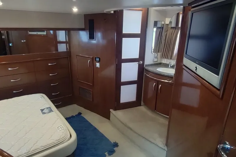 Slide: The Image of Luxurious interior of 2007 Carver 52 Voyager yacht with bedroom and bathroom. - 10