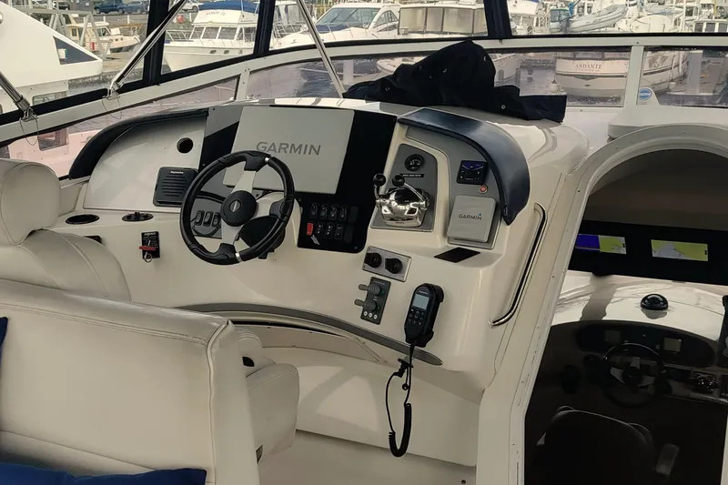 Slide: The Image of 2007 Carver 52 Voyager helm with Garmin navigation system and luxurious seating. - 18