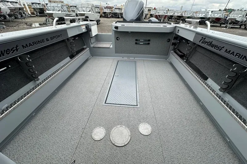 Slide: The Image of 2023 Hewescraft 240 Ocean Pro ET HT boat interior with spacious deck and storage compartments. - 11