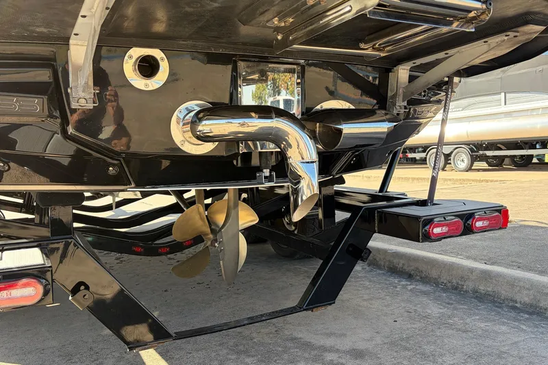 Slide: The Image of 2020 Nautique Super Air Nautique G23 boat propeller and exhaust system close-up. - 10