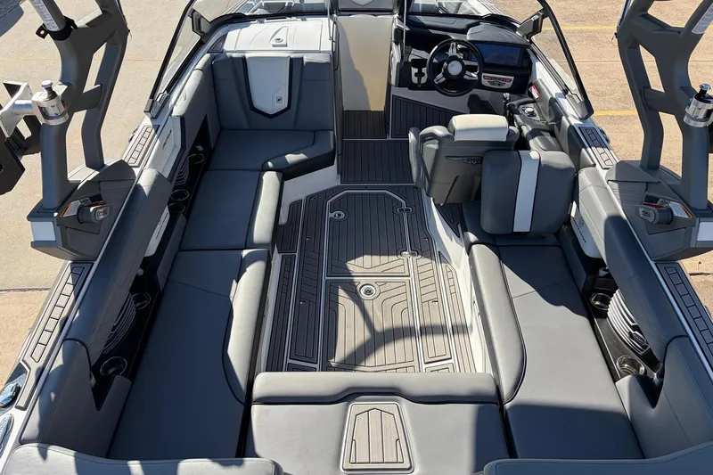 Slide: The Image of 2020 Nautique Super Air Nautique G23 interior with sleek seating and modern dashboard. - 13