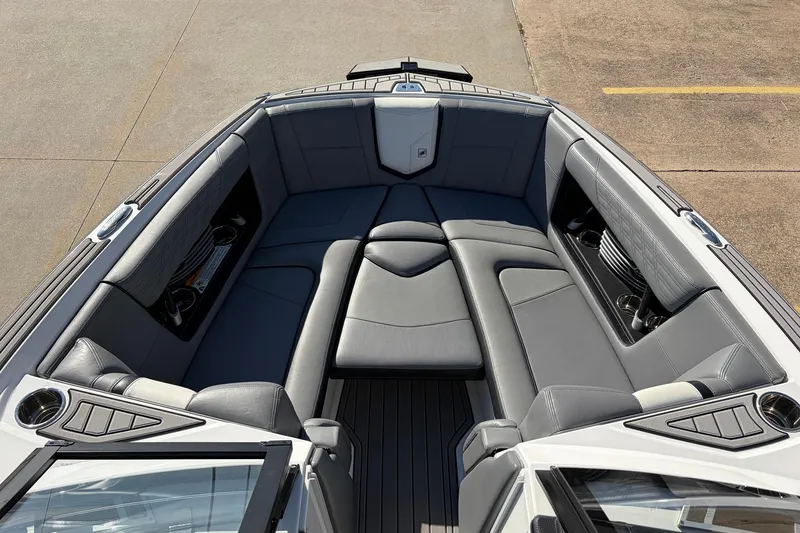 Slide: The Image of 2020 Nautique Super Air Nautique G23 boat interior with gray seating and cup holders. - 14