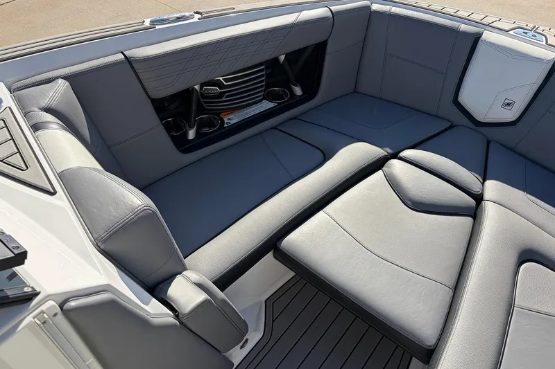 Slide: The Image of 2020 Nautique Super Air Nautique G23 interior with gray seating and cup holders. - 15