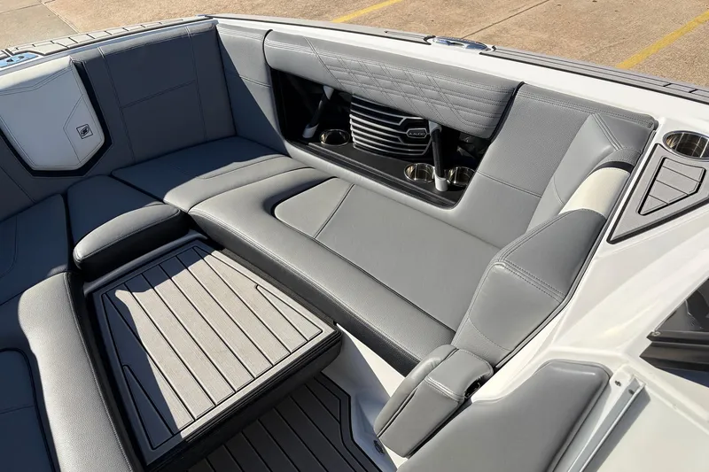 Slide: The Image of 2020 Nautique Super Air Nautique G23 interior with gray seating and cup holders. - 25