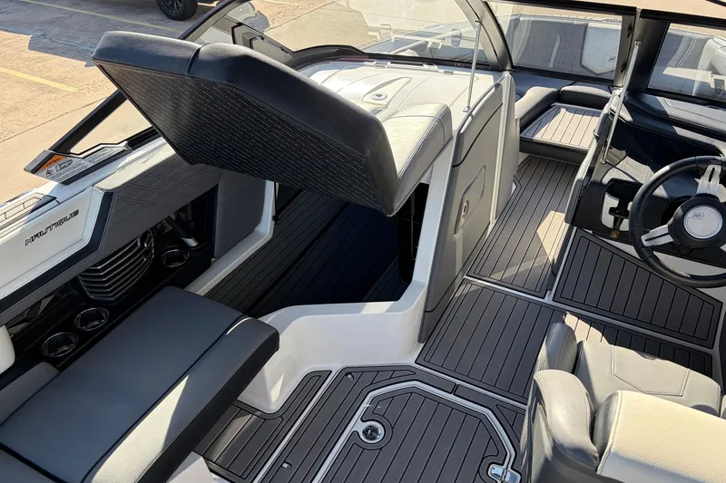 Slide: The Image of 2020 Nautique Super Air Nautique G23 interior with sleek seating and modern dashboard design. - 28