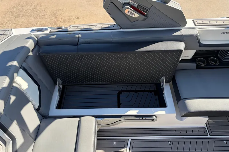Slide: The Image of 2020 Nautique Super Air Nautique G23 interior with open storage compartment. - 32