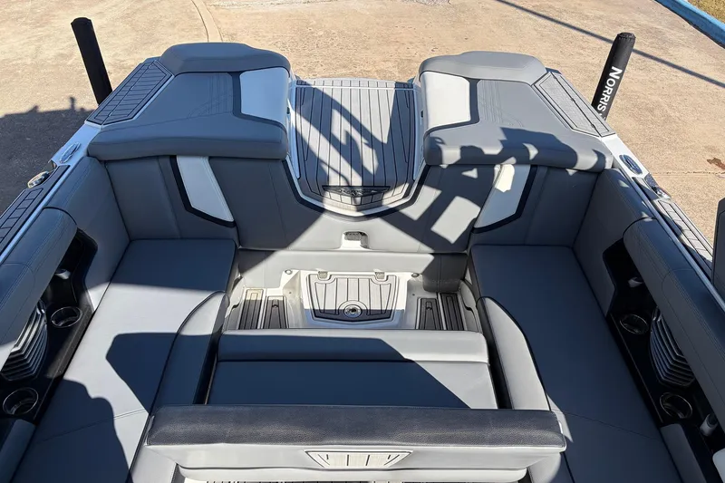 Slide: The Image of 2020 Nautique Super Air Nautique G23 interior with gray seating and cup holders. - 35