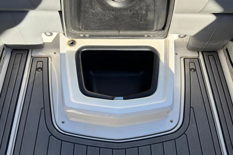 Slide: The Image of 2020 Nautique Super Air Nautique G23 storage compartment with open lid, showcasing interior space. - 39