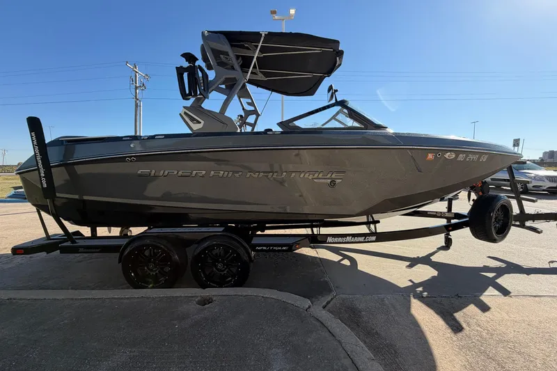 Slide: The Image of 2020 Nautique Super Air Nautique G23 boat on trailer, parked outdoors. - 4