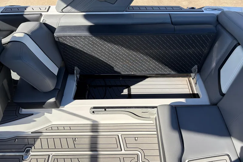 Slide: The Image of 2020 Nautique Super Air Nautique G23 interior storage compartment with open seat. - 41