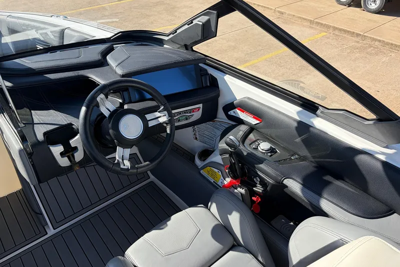 Slide: The Image of 2020 Nautique Super Air Nautique G23 boat interior with steering wheel and dashboard controls. - 45