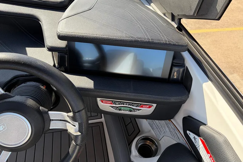Slide: The Image of 2020 Nautique Super Air Nautique G23 dashboard with touchscreen and control buttons. - 47