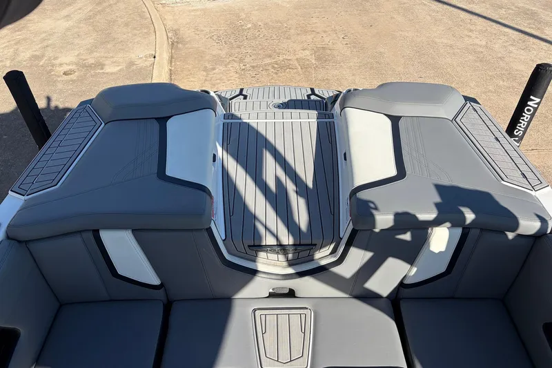 Slide: The Image of 2020 Nautique Super Air Nautique G23 boat interior with gray seating and deck. - 50