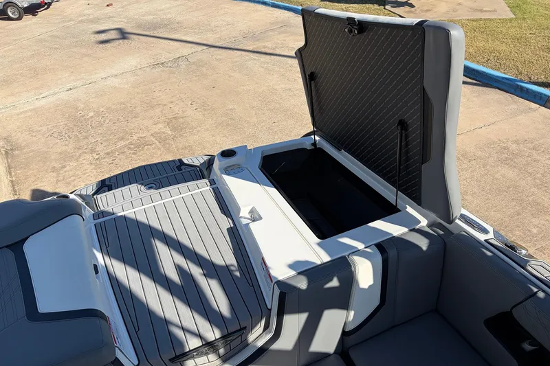 Slide: The Image of 2020 Nautique Super Air Nautique G23 boat with open storage compartment. - 51