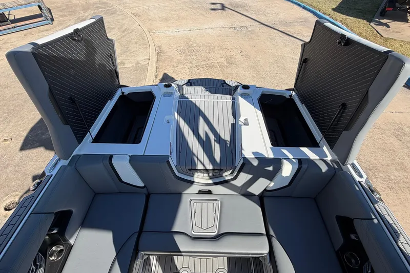 Slide: The Image of 2020 Nautique Super Air Nautique G23 boat interior with open storage compartments. - 55