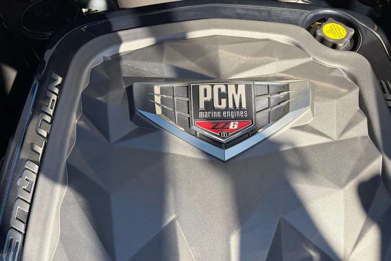 Slide: The Image of Engine cover of 2020 Nautique Super Air Nautique G23 with PCM marine engines logo. - 58
