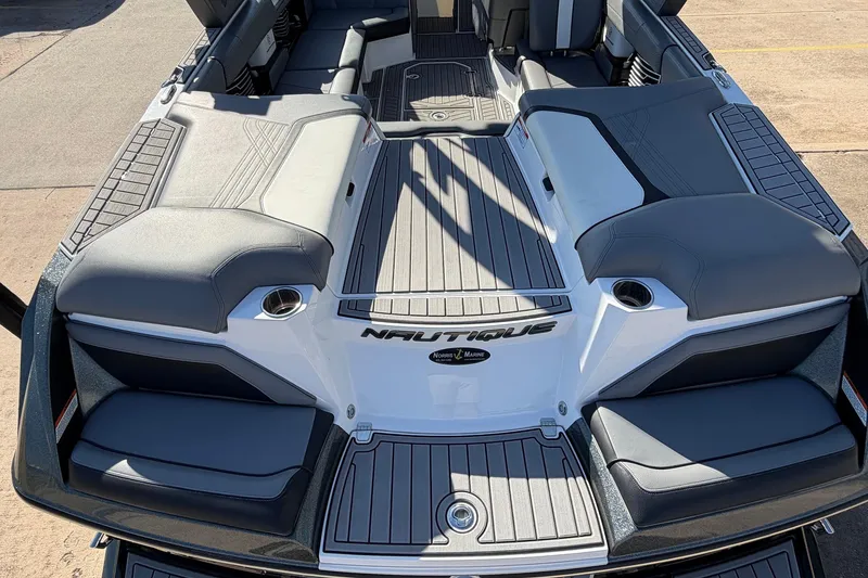 Slide: The Image of 2020 Nautique Super Air Nautique G23 boat interior with gray seating and deck. - 61