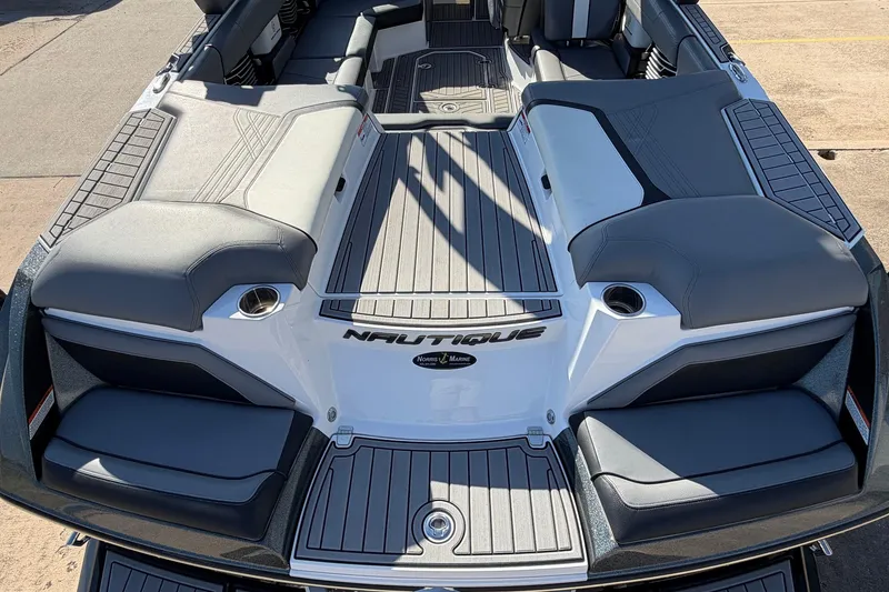Slide: The Image of 2020 Nautique Super Air Nautique G23 boat interior with gray seating and deck. - 62