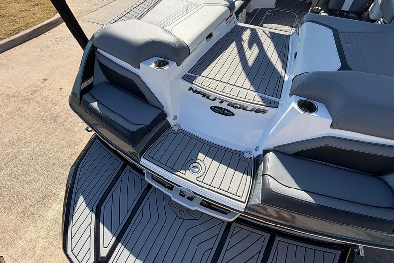 Slide: The Image of 2020 Nautique Super Air Nautique G23 boat interior with sleek seating and deck design. - 63
