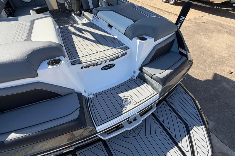 Slide: The Image of 2020 Nautique Super Air Nautique G23 boat interior with gray seating and deck. - 64