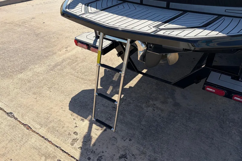 Slide: The Image of 2020 Nautique Super Air Nautique G23 boat with extended swim platform ladder. - 9