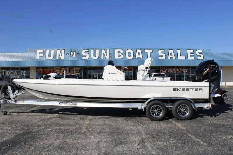 The Image of 2026 Skeeter SX230 boat on trailer at Fun-N-Sun Boat Sales dealership. - 1