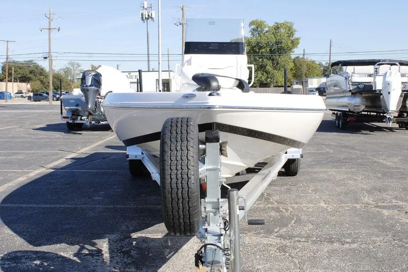 Slide: The Image of 2026 Skeeter SX230 boat on trailer in parking lot, front view. - 12