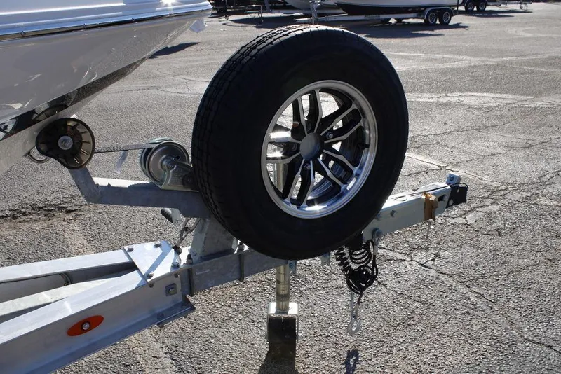 Slide: The Image of Trailer hitch with spare tire for 2026 Skeeter SX230 boat. - 13