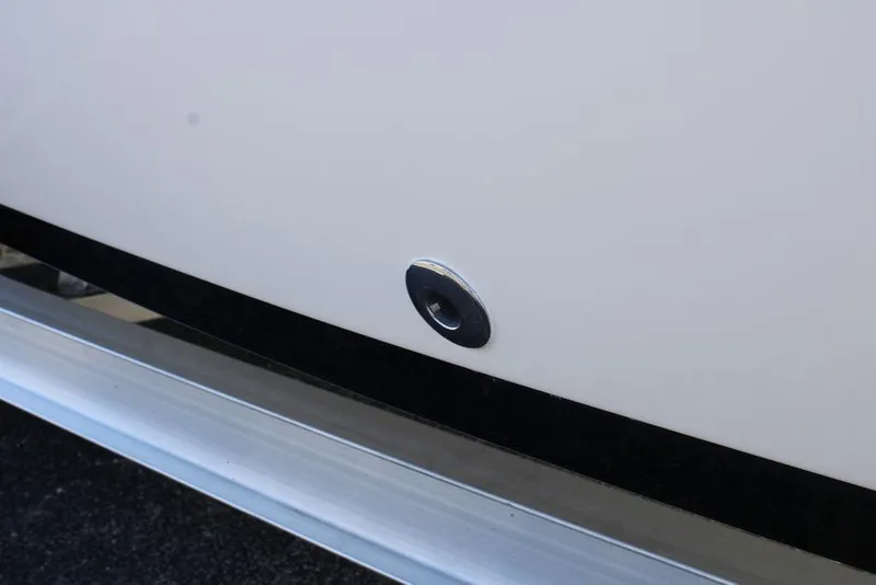 Slide: The Image of Close-up of a 2026 Skeeter SX230 boat hull detail with a metal fitting. - 24