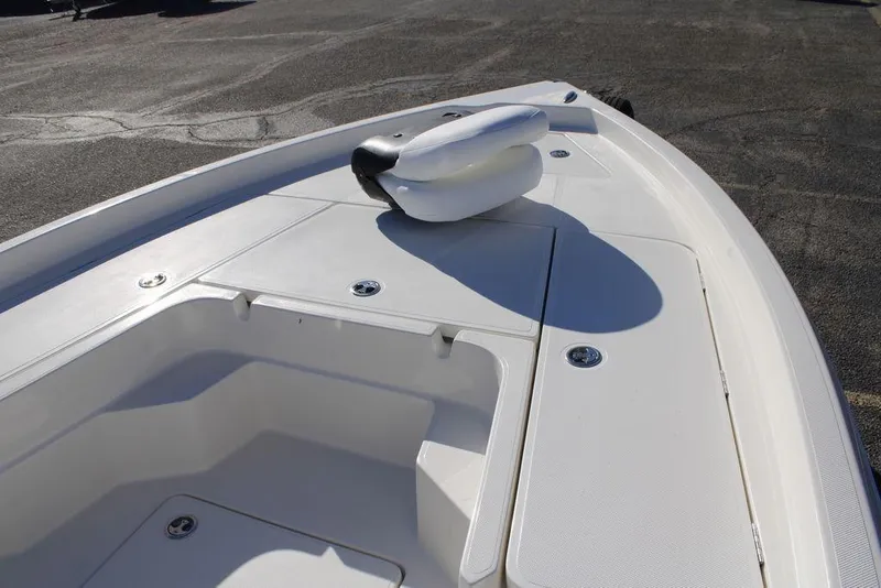 Slide: The Image of 2026 Skeeter SX230 boat deck with storage compartments and anchor. - 25