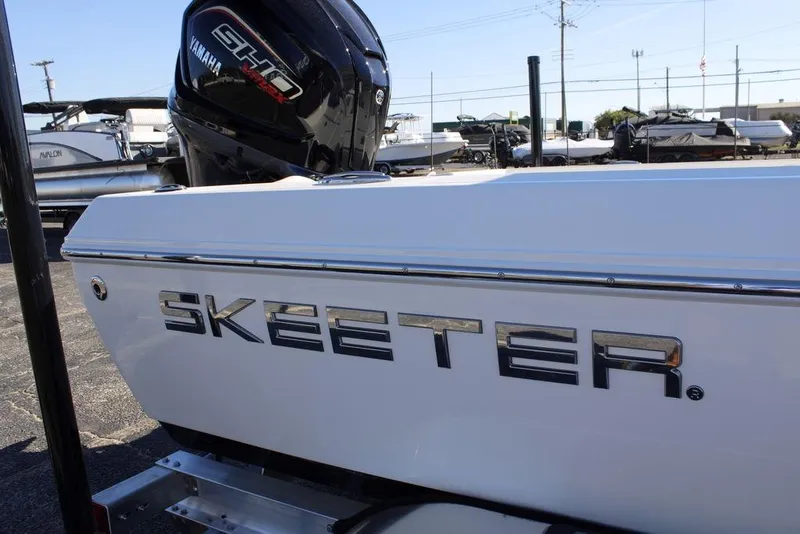 Slide: The Image of 2026 Skeeter SX230 boat with Yamaha engine, displayed outdoors. - 8