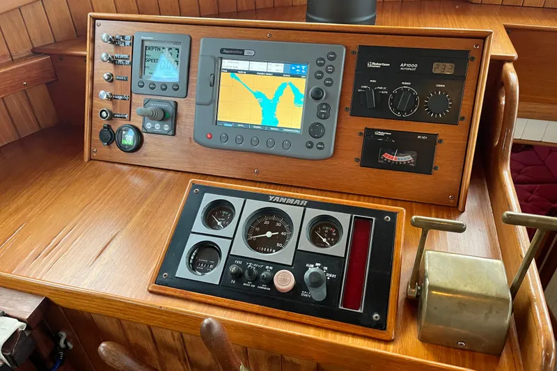 Slide: The Image of Control panel of a 1987 Liberty Gatsby boat with navigation and engine gauges. - 22