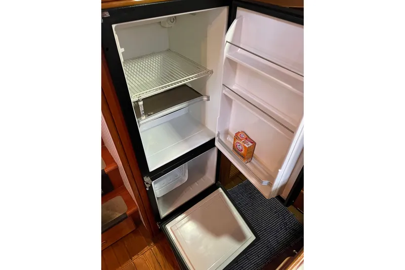 Slide: The Image of Open Liberty Gatsby 1987 refrigerator with Arm & Hammer baking soda inside. - 27