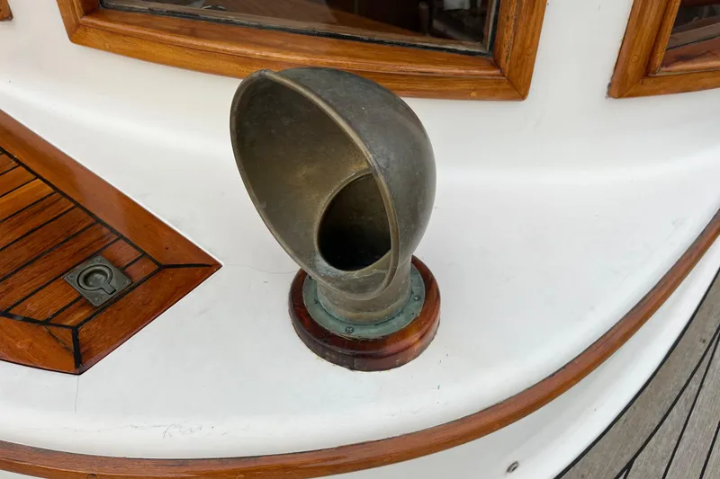 Slide: The Image of Vintage Liberty Gatsby 1987 boat detail with brass vent and wooden trim. - 40