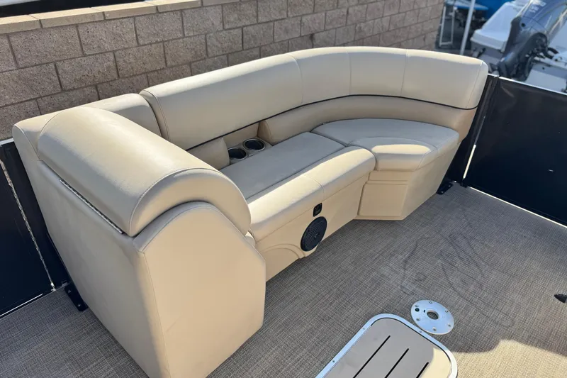 Slide: The Image of Luxurious seating on 2020 Bentley Pontoons 223 Cruise boat, featuring beige upholstery and cup holders. - 11