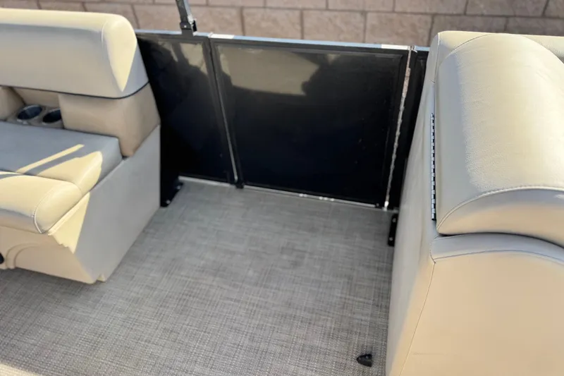 Slide: The Image of 2020 Bentley Pontoons 223 Cruise interior with beige seating and black panel. - 16