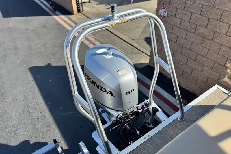 Slide: The Image of 2020 Bentley Pontoons 223 Cruise with Honda 150 outboard motor, docked outdoors. - 18