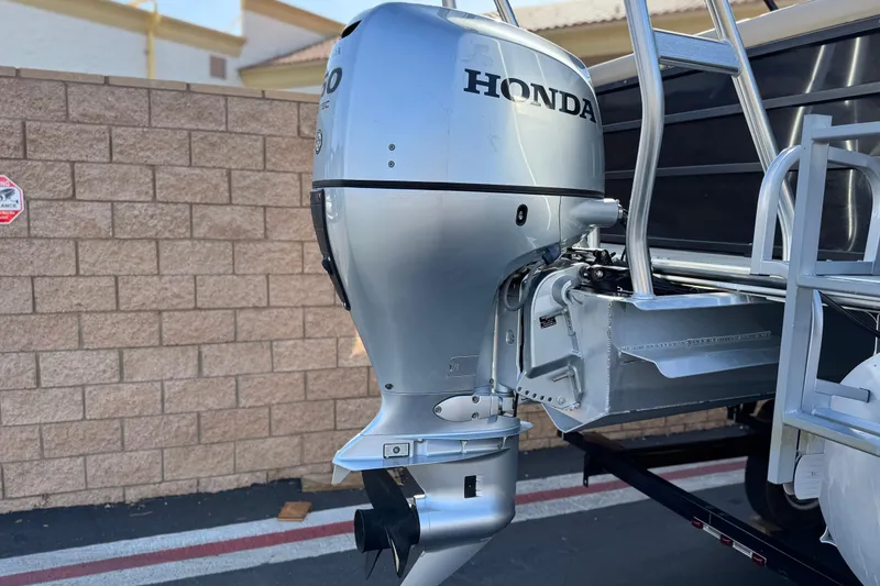 Slide: The Image of 2020 Bentley Pontoons 223 Cruise with Honda outboard motor, parked near brick wall. - 7