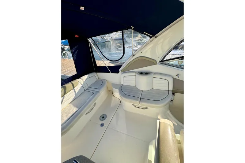 Slide: The Image of Interior of 2007 Sea Ray 290 Sundancer boat with seating and canopy. - 12