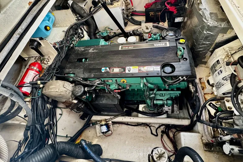 Slide: The Image of Engine compartment of a 2007 Sea Ray 290 Sundancer boat, featuring a well-maintained motor. - 26