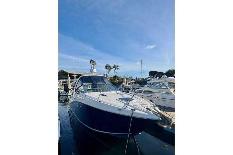 Slide: The Image of 2007 Sea Ray 290 Sundancer boat docked at marina under clear blue sky. - 7